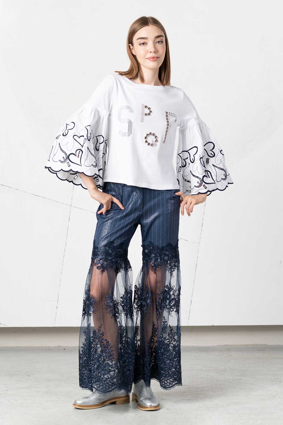 Pantalone con inserti di pizzo